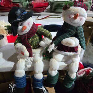 Singing Snowmen sitting on a edge; Signing Walking in a Winter wonderland